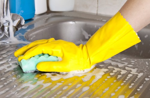 Local upholstery cleaner treating stains on a sofa